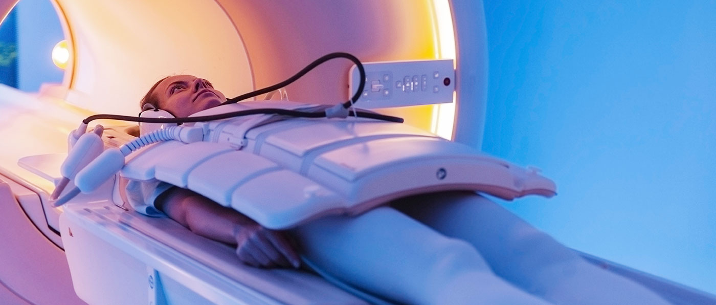 A woman lying in a CT scan machine