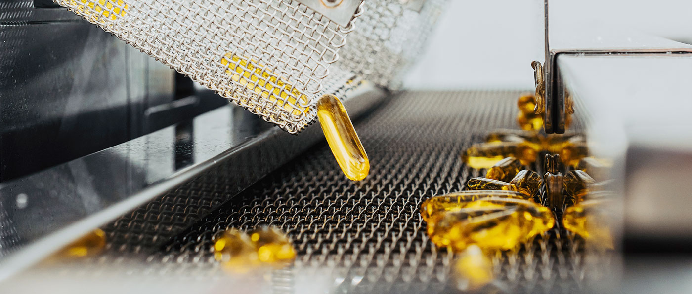 Capsules being poured into a container